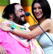 LAURA PAUSINI AND PAVAROTTI Luciano Pavarotti and his Friends, an organization created to help and support carity organizations around the world, a big concert every summer in Modena Italy with Brian May from Queen, Steve Wonder, George Michael, Zucchero, Laura Pausini, Lady Diana as special guest, The Spice girls, Andrea Bocelli, Bono from U2, Liza Minelli, and an incredible list of international guest coming to help childrens as Luciano's Friends