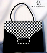 Rita Azzellini  la collezione e firma di una azienda artigianale che porta il suo nome e che si colloca, per consenso e diritto, nel multiforme mondo della moda e della creazione tipicamente italiana. Da Designer di "Borse e Pellame", Rita vanta inizi assai precoci avendo appreso, sin da giovanissima, l'arte della "creazione" durante un lungo percorso di apprendimento e supporto accanto ad autentici Maestri del settore